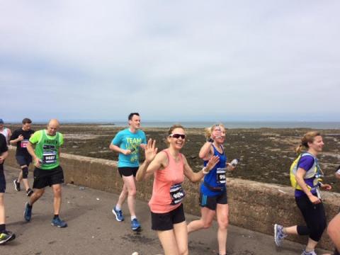 Nikki, (in the orange vest), seen here at mile 14.